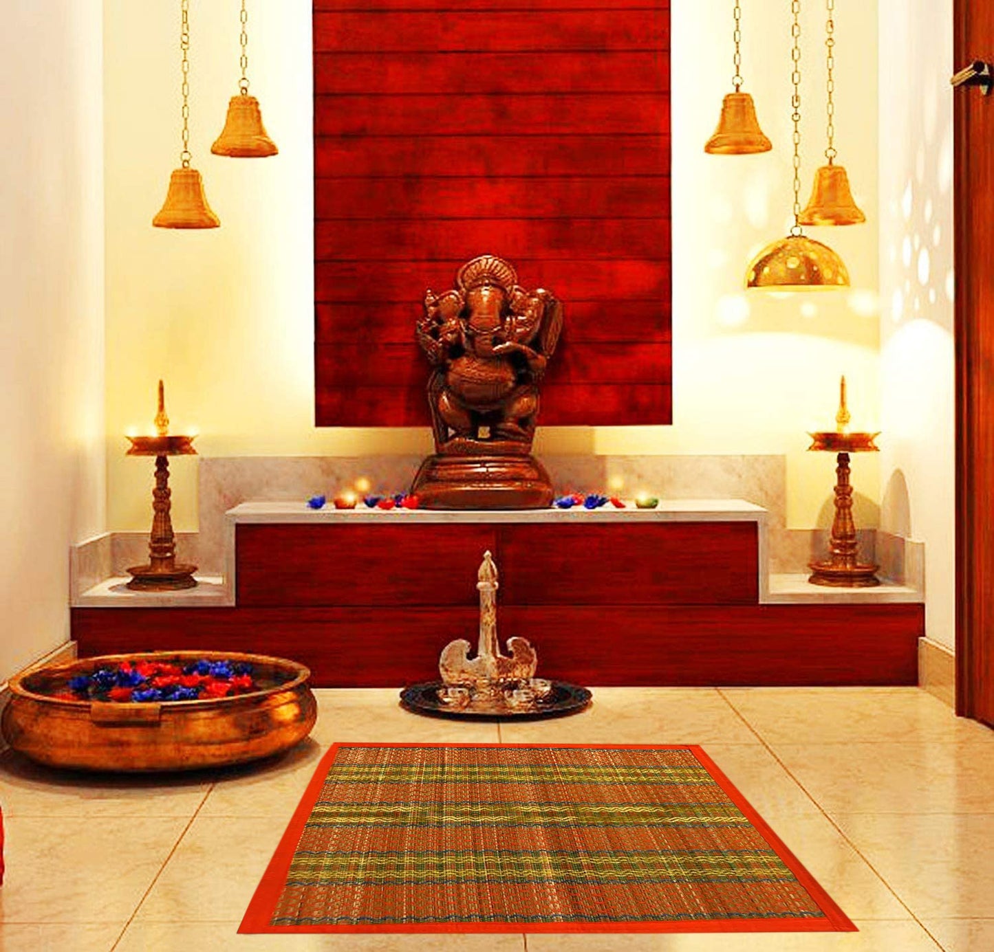 Madurkathi pooja mat laid out near brass kalash
