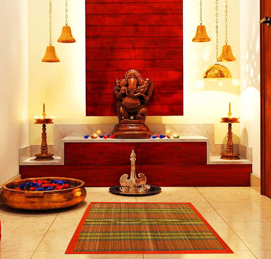 Madurkathi pooja mat laid out near brass kalash